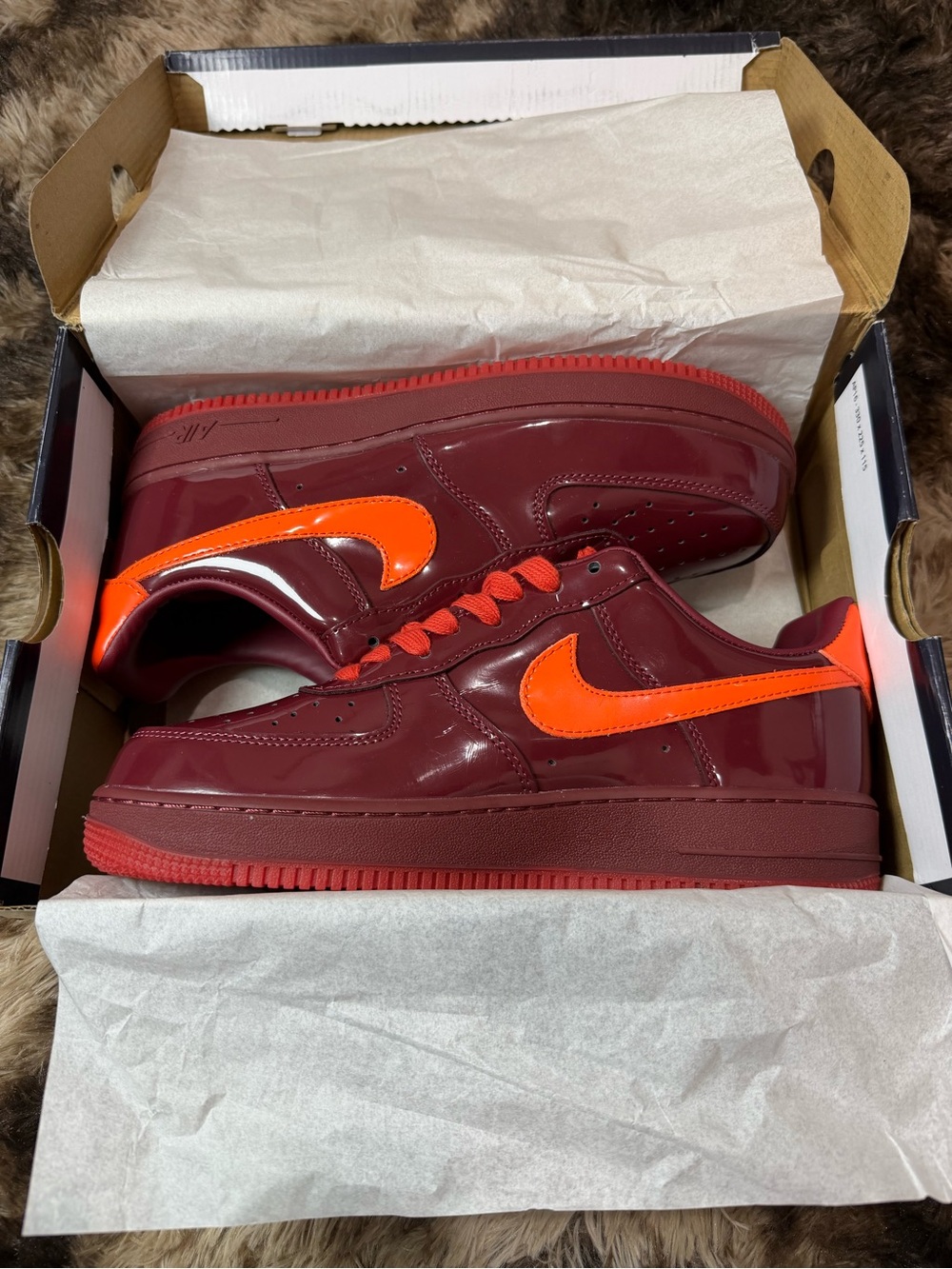 Nike Low-Top Sneakers in Burgundy with Bright Orange Swoosh